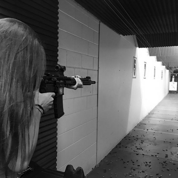 women shooting with a rifle in shooting range