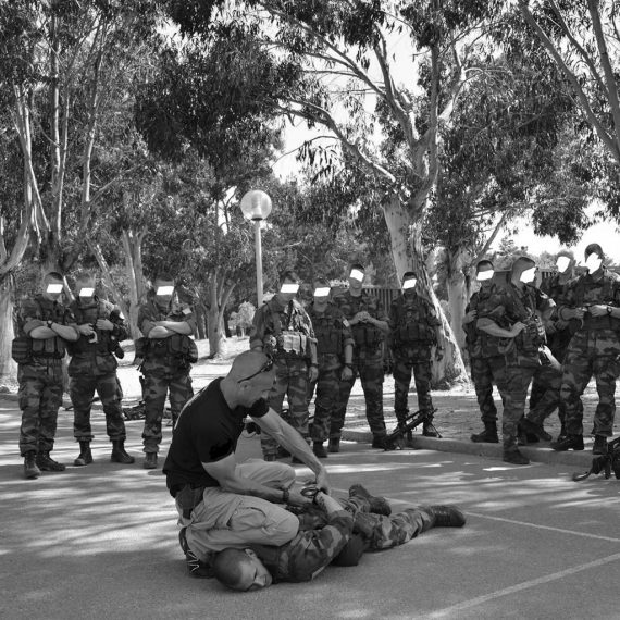 Jean-paul Jauffret handcuffing a French Foreign Legion soldier during training